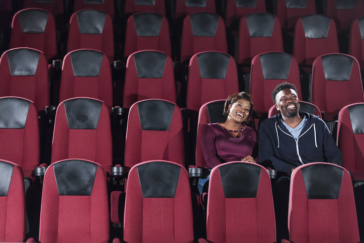African-American couple alone in movie theater