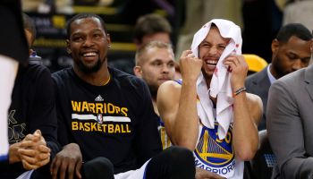 Golden State Warriors' Stephen Curry (30) laughs on the bench with Golden State Warriors' Kevin Durant (35) during their game against the Charlotte Hornets in the fourth quarter at Oracle Arena in Oakland, Calif. on Wednesday, Feb. 1, 2017. (Nhat V. Meyer