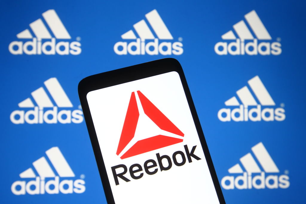 In this photo illustration the Reebok logo seen on a...