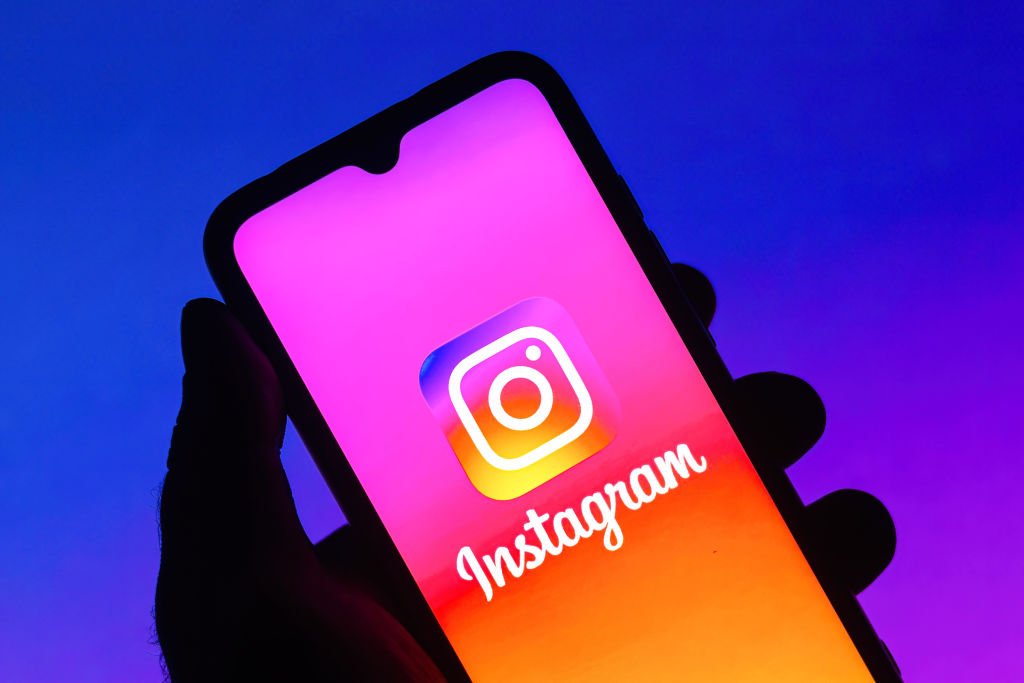 In this photo illustration the Instagram logo seen displayed...