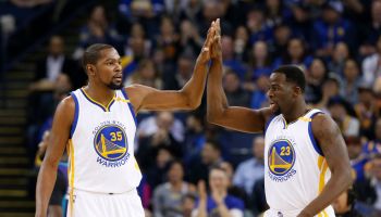 Golden State Warriors' Kevin Durant (35) high-fives Golden State Warriors' Draymond Green (23) during their game against the Charlotte Hornets in the first quarter at Oracle Arena in Oakland, Calif. on Wednesday, Feb. 1, 2017. (Nhat V. Meyer/Bay Area News