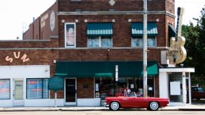 Red Ford Thunderbird outside Sun Studio with Gibson guitar motif Memphis Tennessee USA