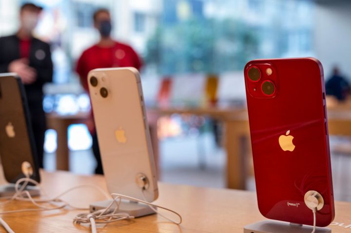 The iphone 13 mini series smartphones are seen displayed for...