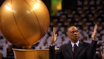 (060508 Boston, MA) Kareem Abdul-Jabbar gestures in front of the trophy before Game 1 of the NBA finals basketball series between the Celtics and the Los Angeles Lakers at the TD Banknorth GardenThursday, June 5, 2008. Staff Photo by Matt Stone