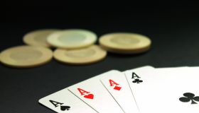 Close-Up Of Four Aces Cards On Table