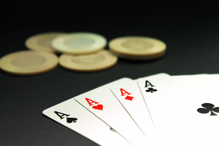 Close-Up Of Four Aces Cards On Table