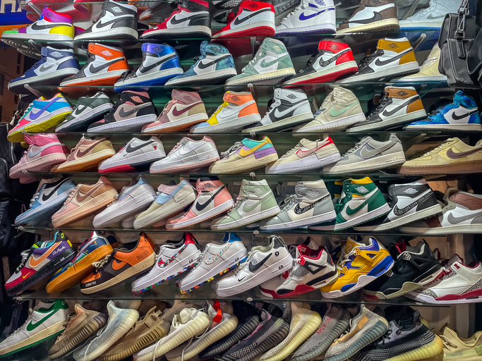 Rows of Counterfeit Fake Poor quality Trainers such as Nike Air Jordans and Adidas being sold at backstreet markets to unknowing tourists. Good copies that fool the buyer but often fall apart very quickly due to cheap and inexpensive quality