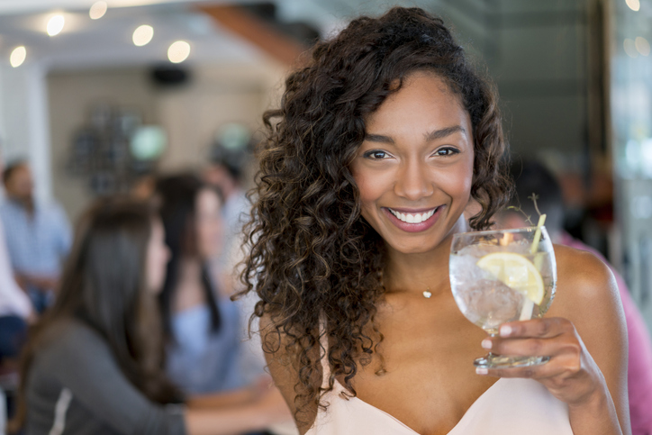 Portrait of a beautiful woman having drinks at a bar