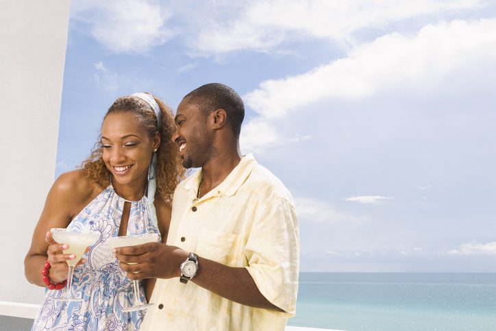 Couple having drinks on balcony
