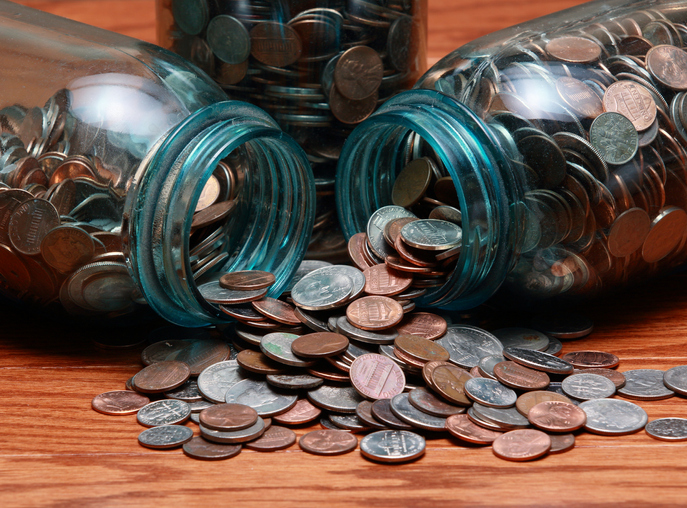 Coins in a blue canning jar