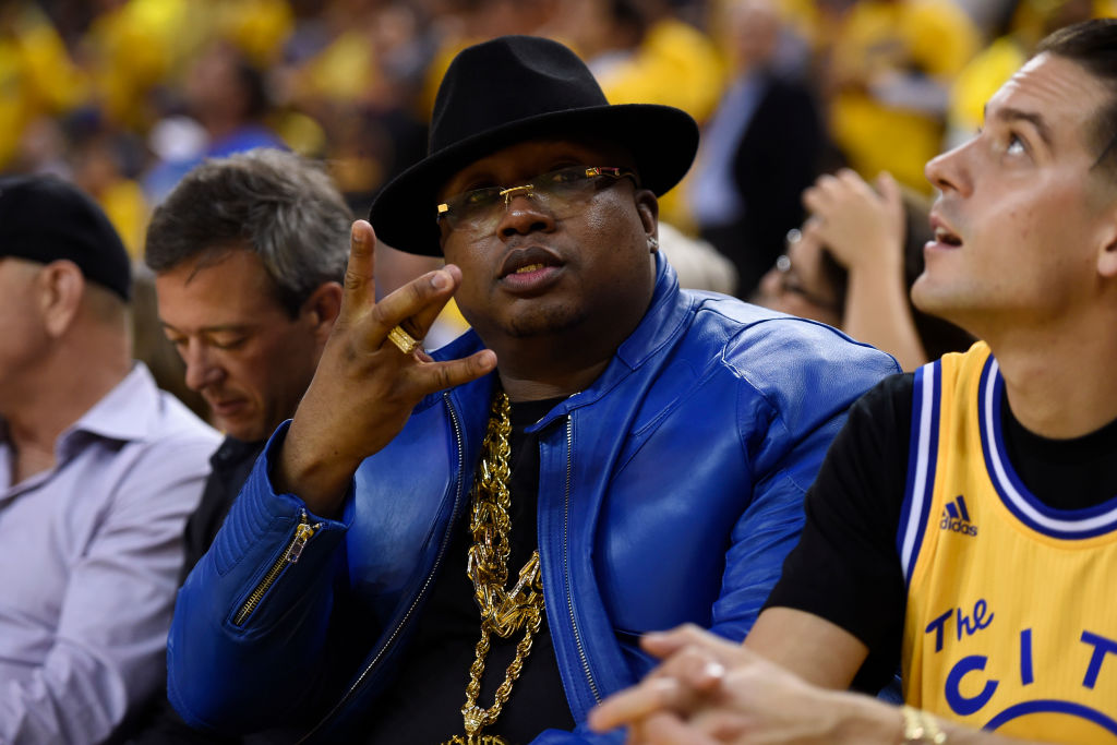 Rapper E-40 gestures while sitting courtside in the fourth quarter of Game 1 of the NBA Finals at Oracle Arena in Oakland, Calif., on Thursday, June 2, 2016. Golden State Warriors defeated the Cleveland Cavaliers 104-89. (Jose Carlos Fajardo/Bay Area News