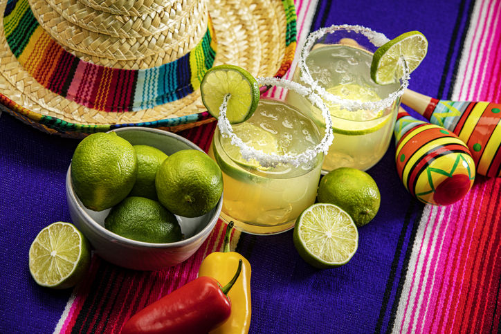Happy Cinco de Mayo with two Margarita Glasses on a Colorful Background