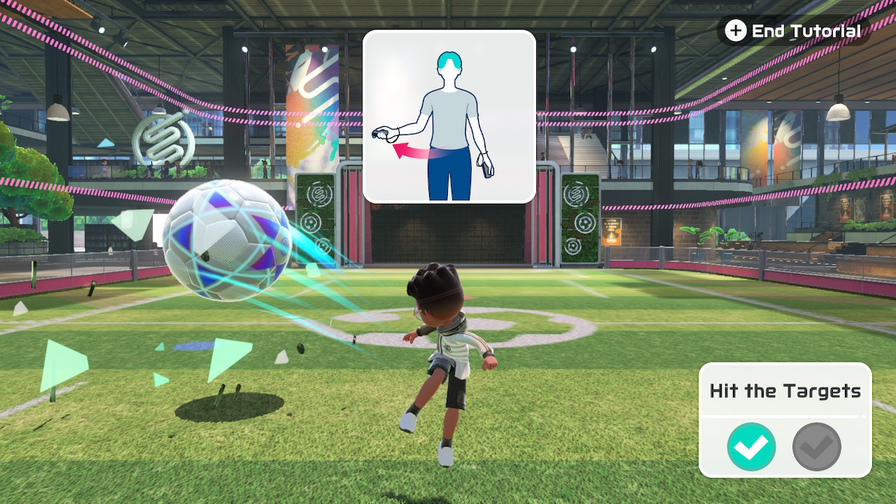 Screenshot from Nintendo Switch Sports video game. The screen shows the player learning how to play soccer by using the Joy-Con controller. Leg strap accessory required for some soccer gameplay.