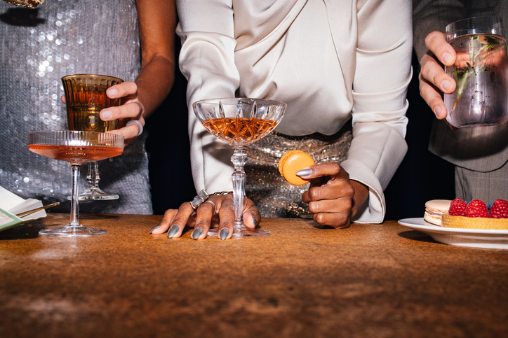 Group of Unrecognizable People Snacking and Drinking at a Fancy Party