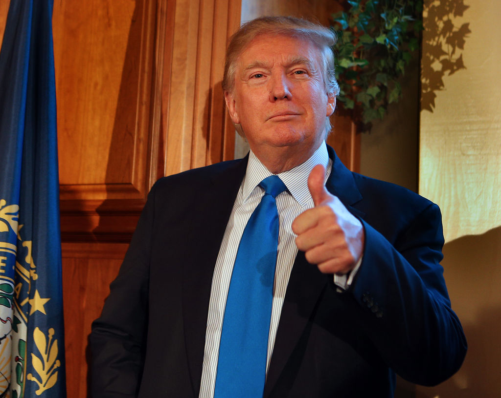 031915 Amherst, NH) Donald Trump, possible presidential candidate in 2016, gives the thumbs up as he is introduced at a private house party in Amherst, NH (Thursday,March 19, 2015). Staff Photo by Nancy Lane