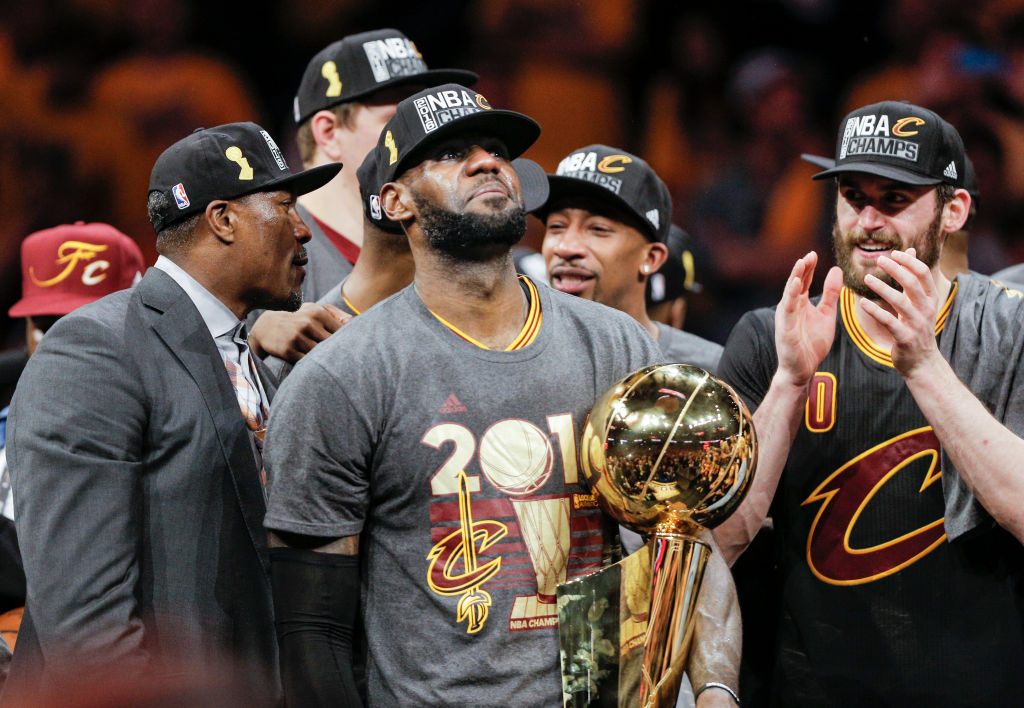 Cleveland Cavaliers' LeBron James holds the the Larry O’Brien NBA Championship Trophy after defeating Golden State Warriors 93 to 89 in Game 7 of the NBA Finals at Oracle Arena on Sunday, June 19, 2016 in Oakland, Calif