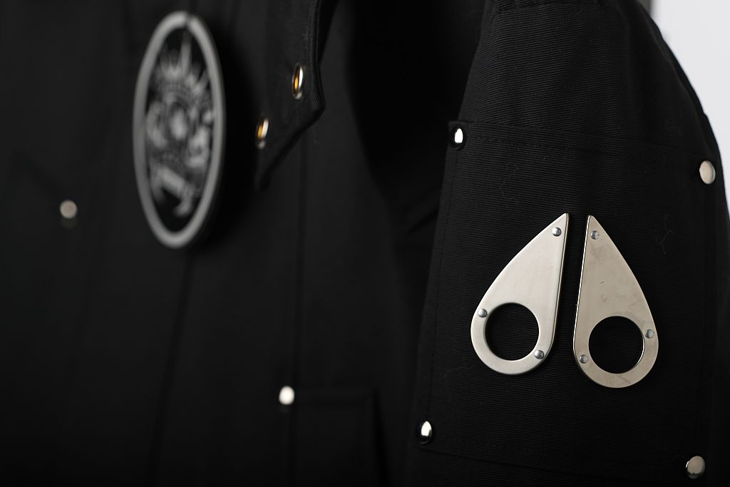 Made in Canada Moose Knuckle coat with it's label, cardbord label and arm logo.