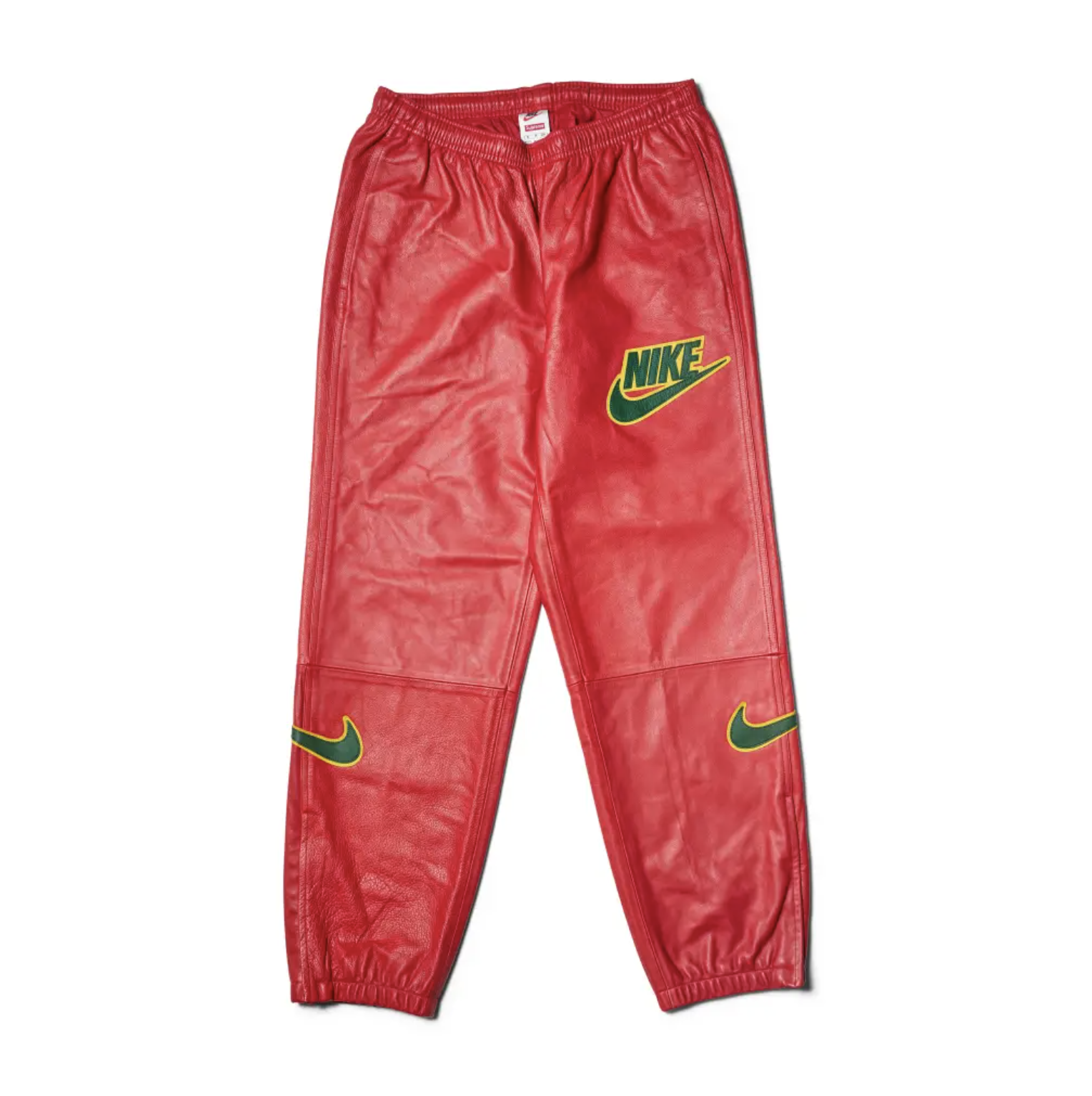 Red Nike athletic pants with the Nike logo and swoosh design.