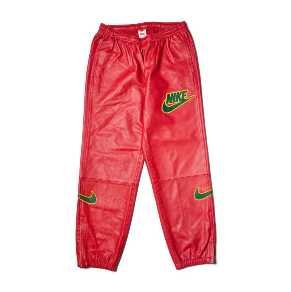 Red Nike athletic pants with the Nike logo and swoosh design.