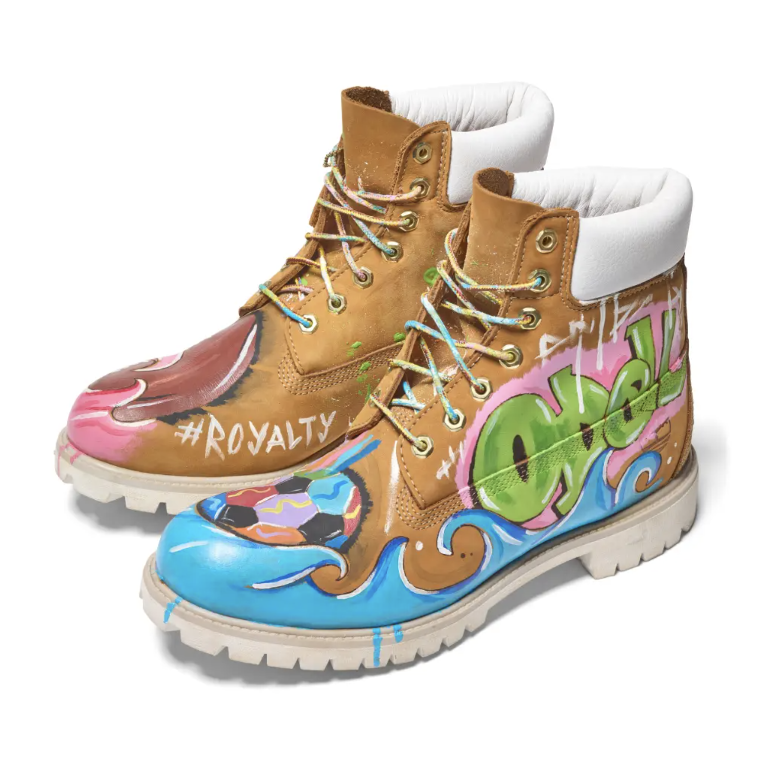 Colorful, graffiti-style painted boots with the text "#ROYALTY" and various abstract designs.