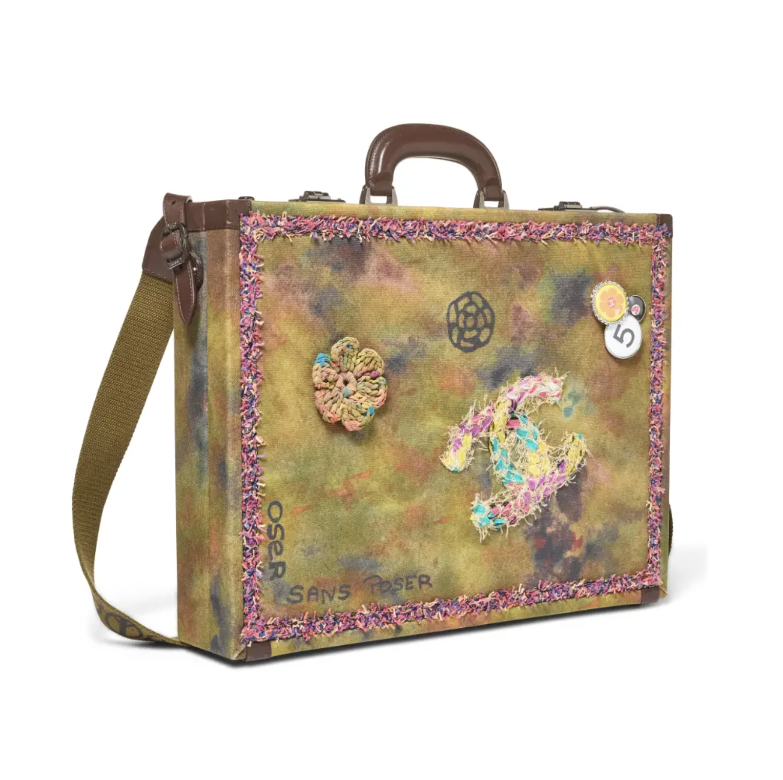 A colorful, patterned suitcase with floral and abstract designs, featuring the text "OGIO SANS POSER" and a numbered tag.