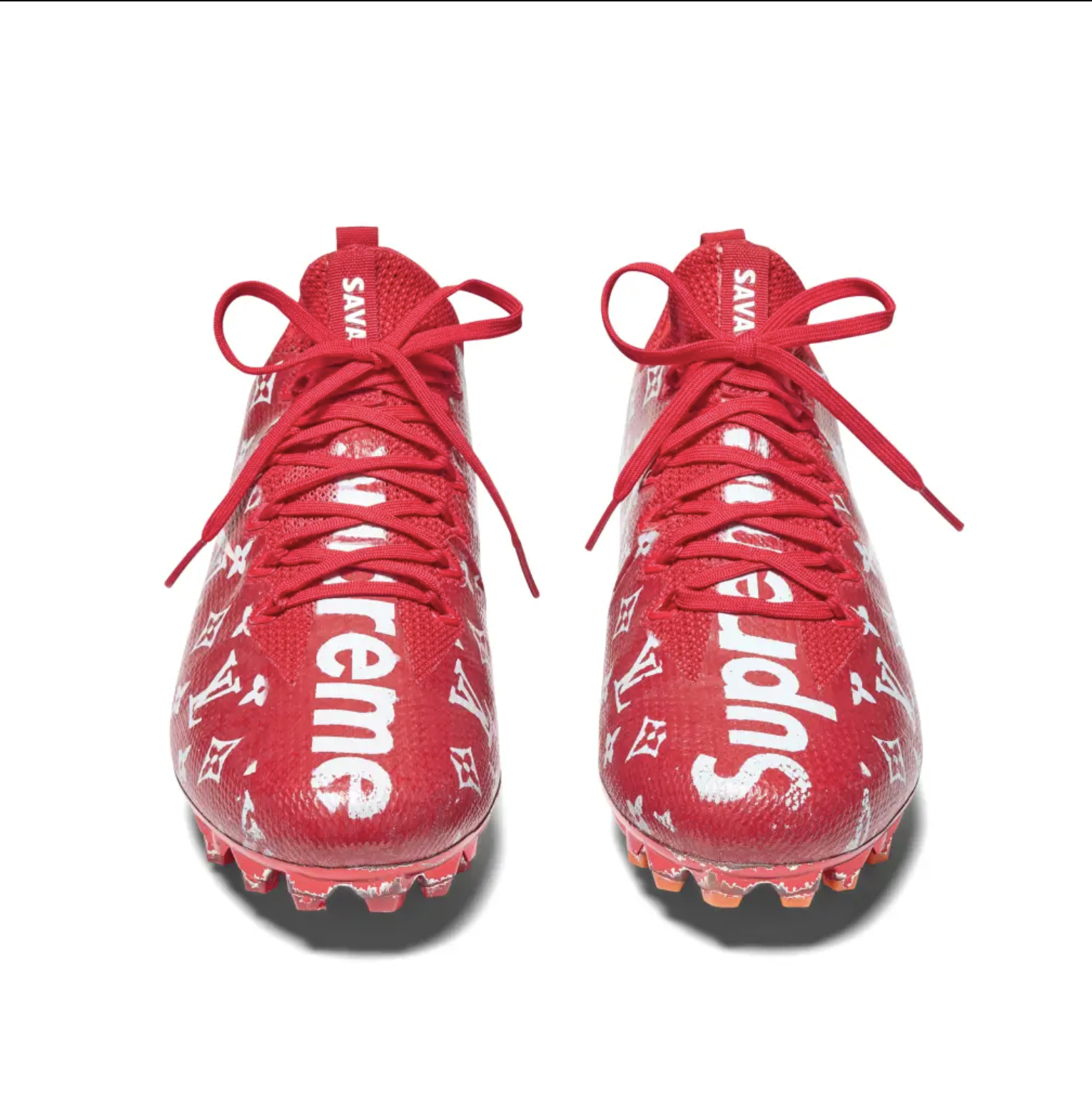 Red sneakers with white Supreme logo pattern