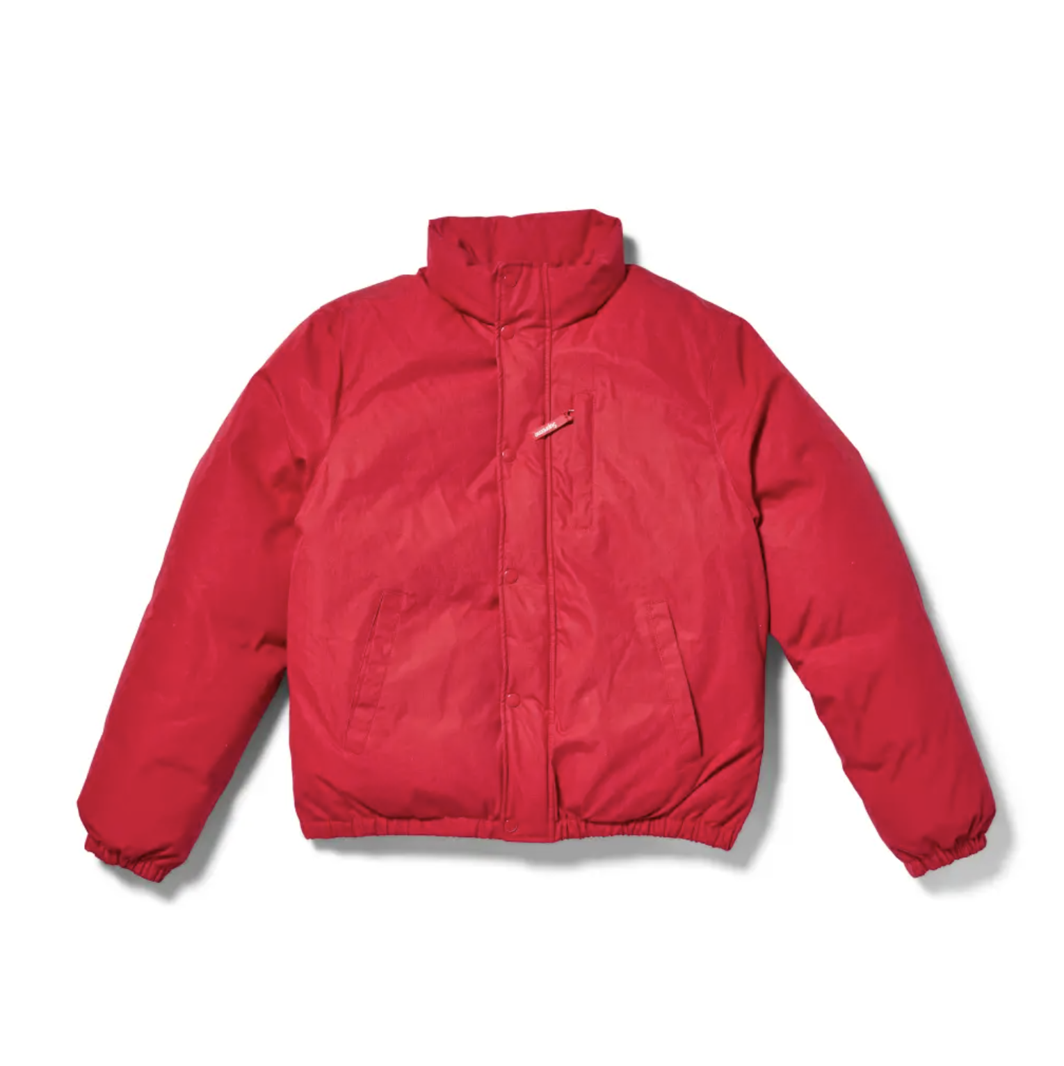 A red puffy winter jacket with a zipper closure.