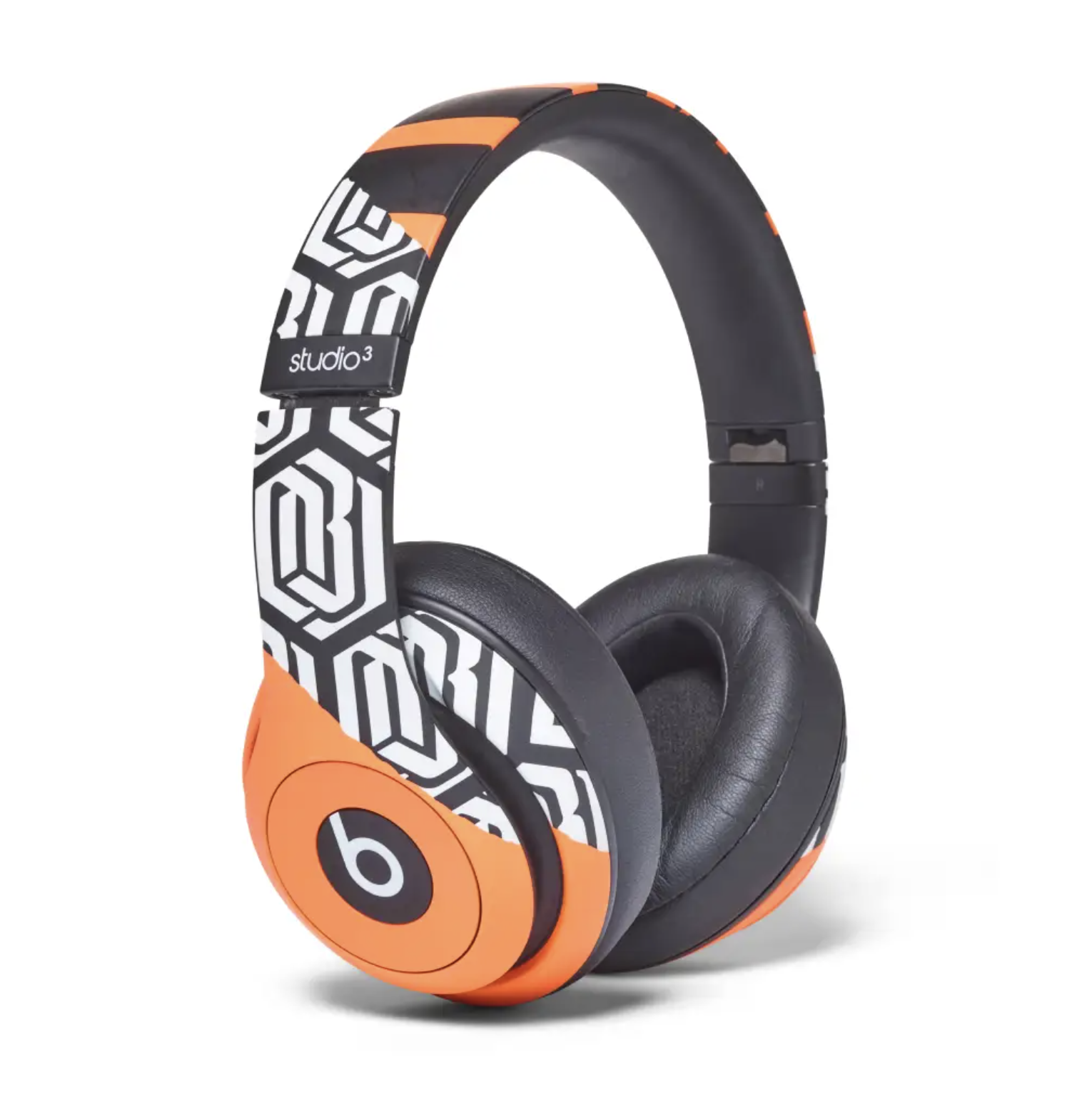 Beats by Dre studio3 wireless headphones in black and orange color scheme with distinctive Beats logo and branding.