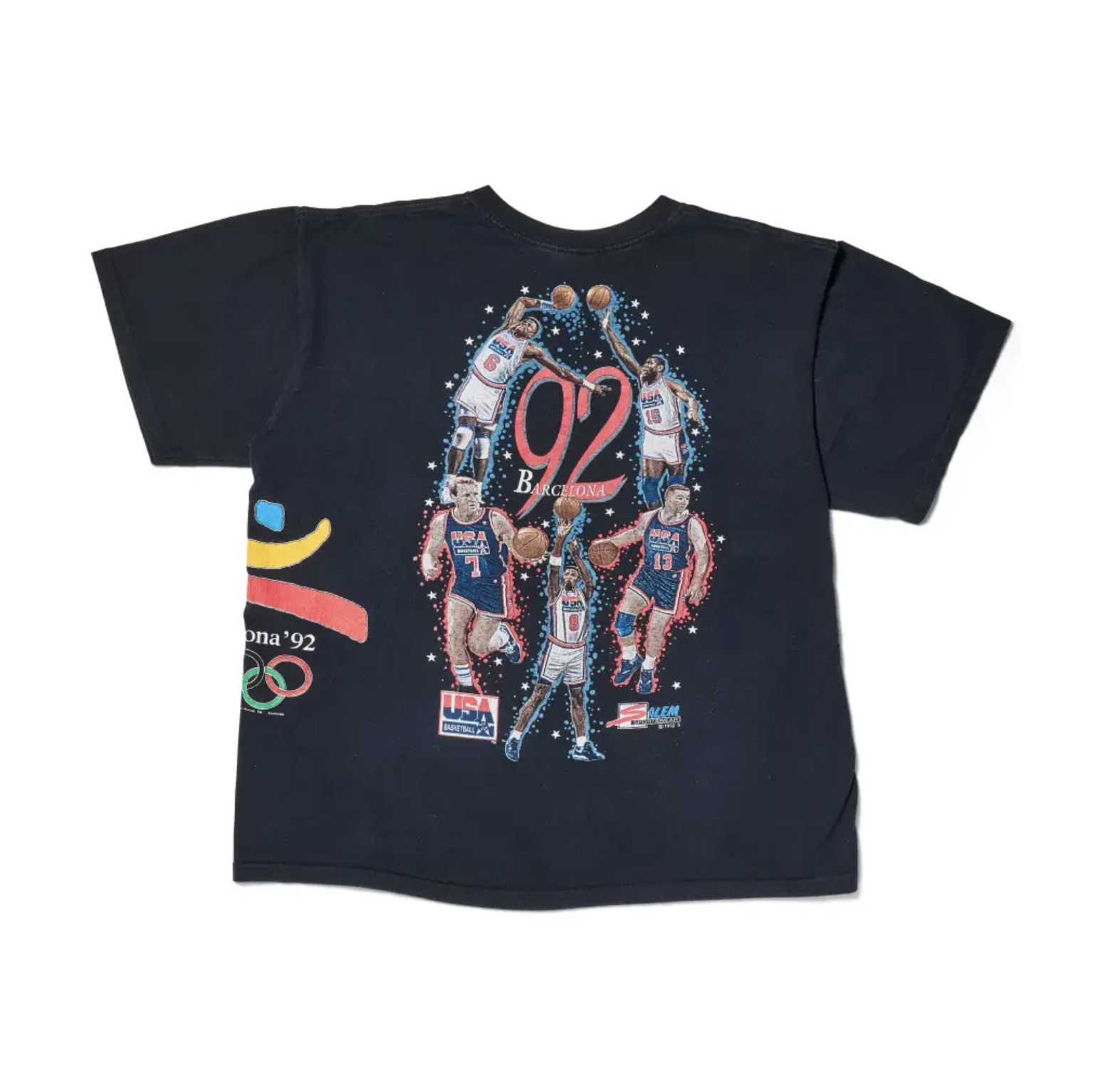 Basketball players in action with "Barcelona '92" and "USA" text on a black t-shirt design with stars.