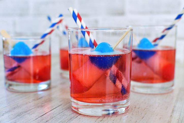 Red White & Blue cocktails - patriotic drinks beverage with rocket popsicles striped paper straws.