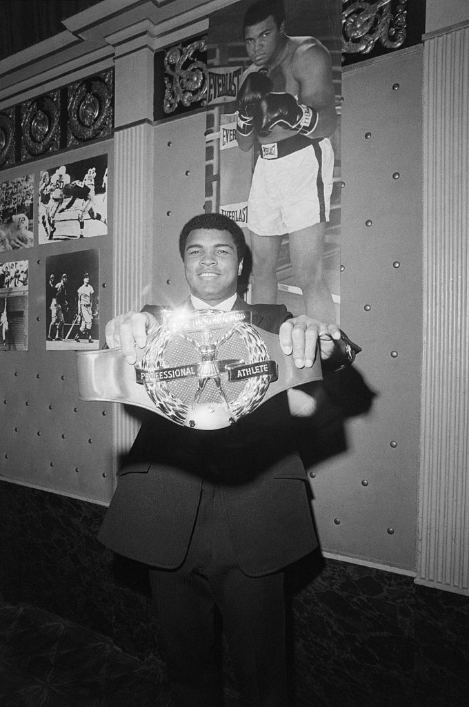 Muhamad Ali Holding an Award