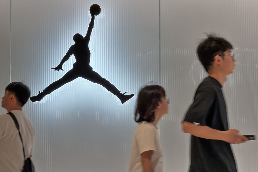 Shoppers Walk Past Jordan Brand Store in Shenzhen