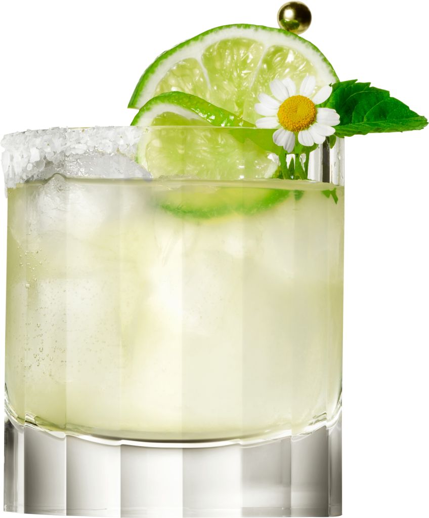 A glass of refreshing lemonade garnished with a lime slice, a daisy flower, and a green olive on a toothpick.