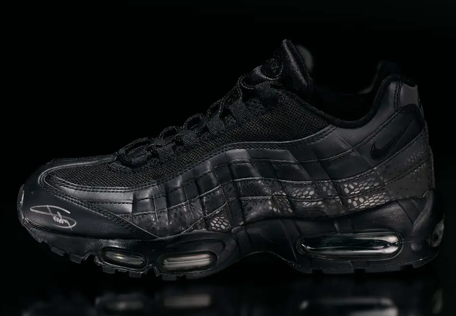 Black Nike Air Max 95 sneaker with textured leather and mesh upper.