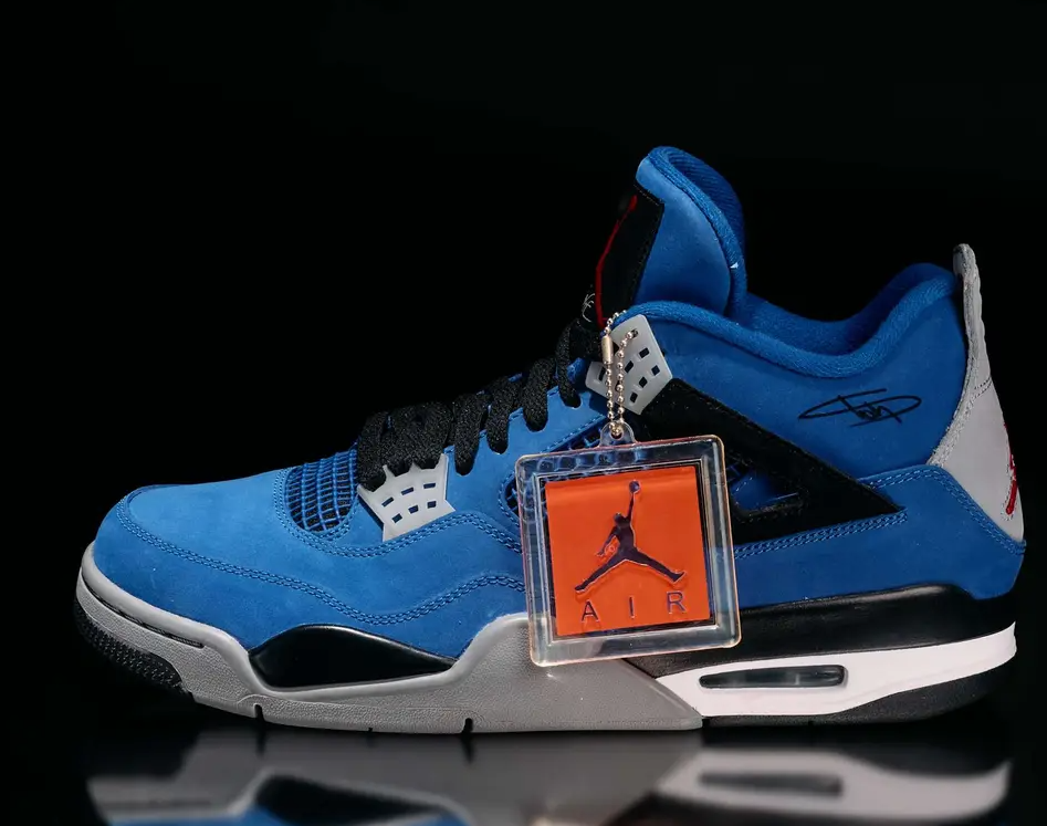 Blue and black Nike Air Jordan 4 sneakers with orange Air Jordan logo tag.