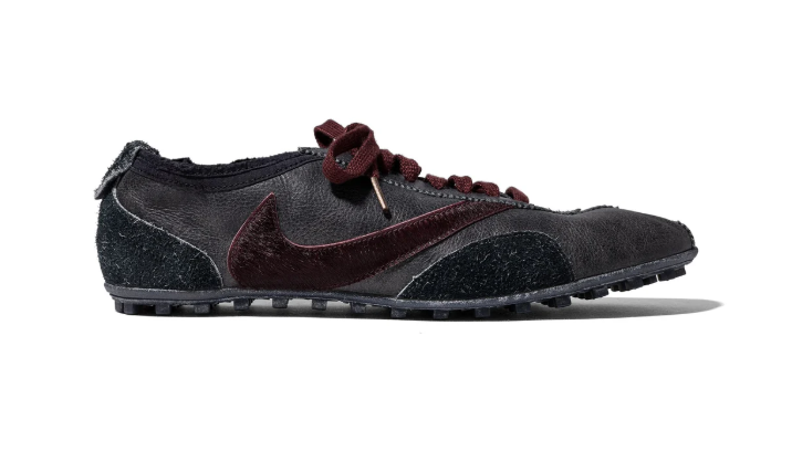 A black and burgundy Nike sneaker with a distinctive swoosh logo and lace-up design.