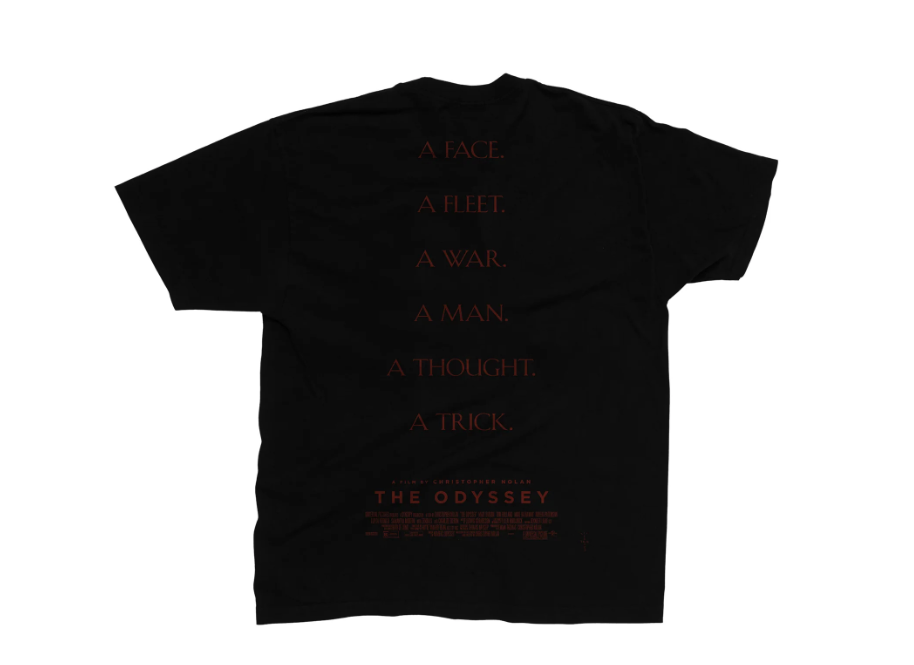 A black t-shirt with text reading "A FACE. A FLEET. A WAR. A MAN. A THOUGHT. A TRICK." and "THE ODYSSEY" logo.