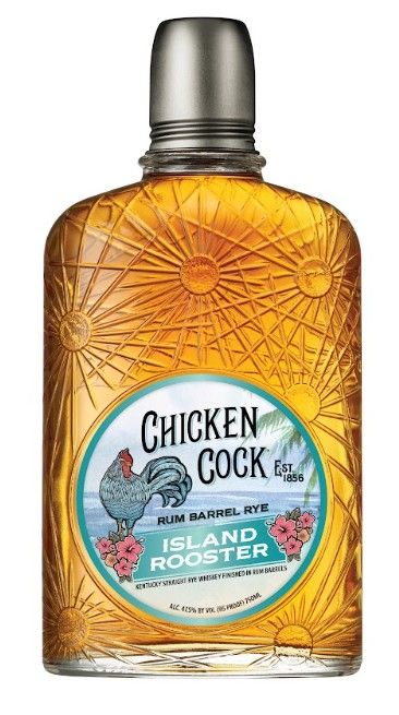 A bottle of Chicken Cock rum barrel rye whiskey with a label featuring a rooster and floral design.