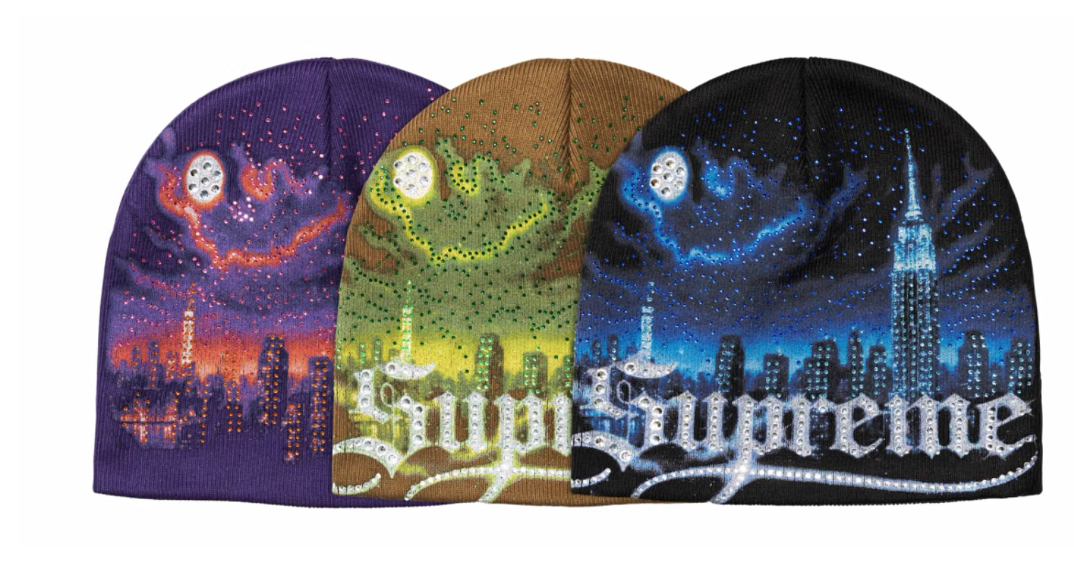 Three colorful knit hats featuring urban skylines and celestial designs against night skies.