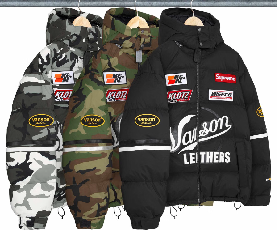 Assorted camouflage and black winter jackets with Vanson, Klotz, and Supreme branding.