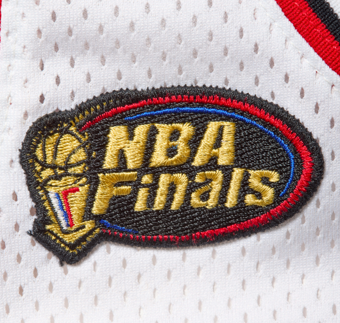 NBA Finals logo on a white and red jersey with a dotted pattern.