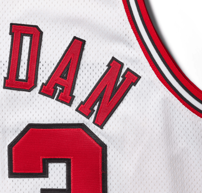 White basketball jersey with the text "DAN" and the number 5 in red.
