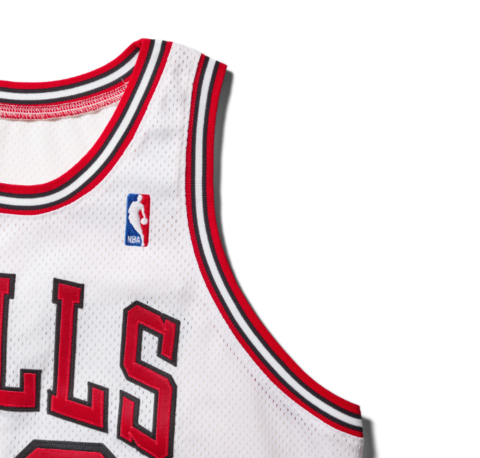 White basketball jersey with red and black stripes and "Bulls" text.