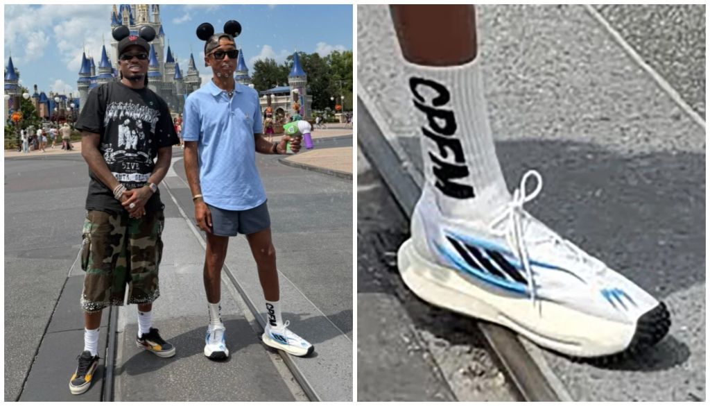 Two people wearing Mickey Mouse ear hats standing in front of Cindercastle at Disney World. One person wearing Adidas sneakers with "CPFM" printed on the side.